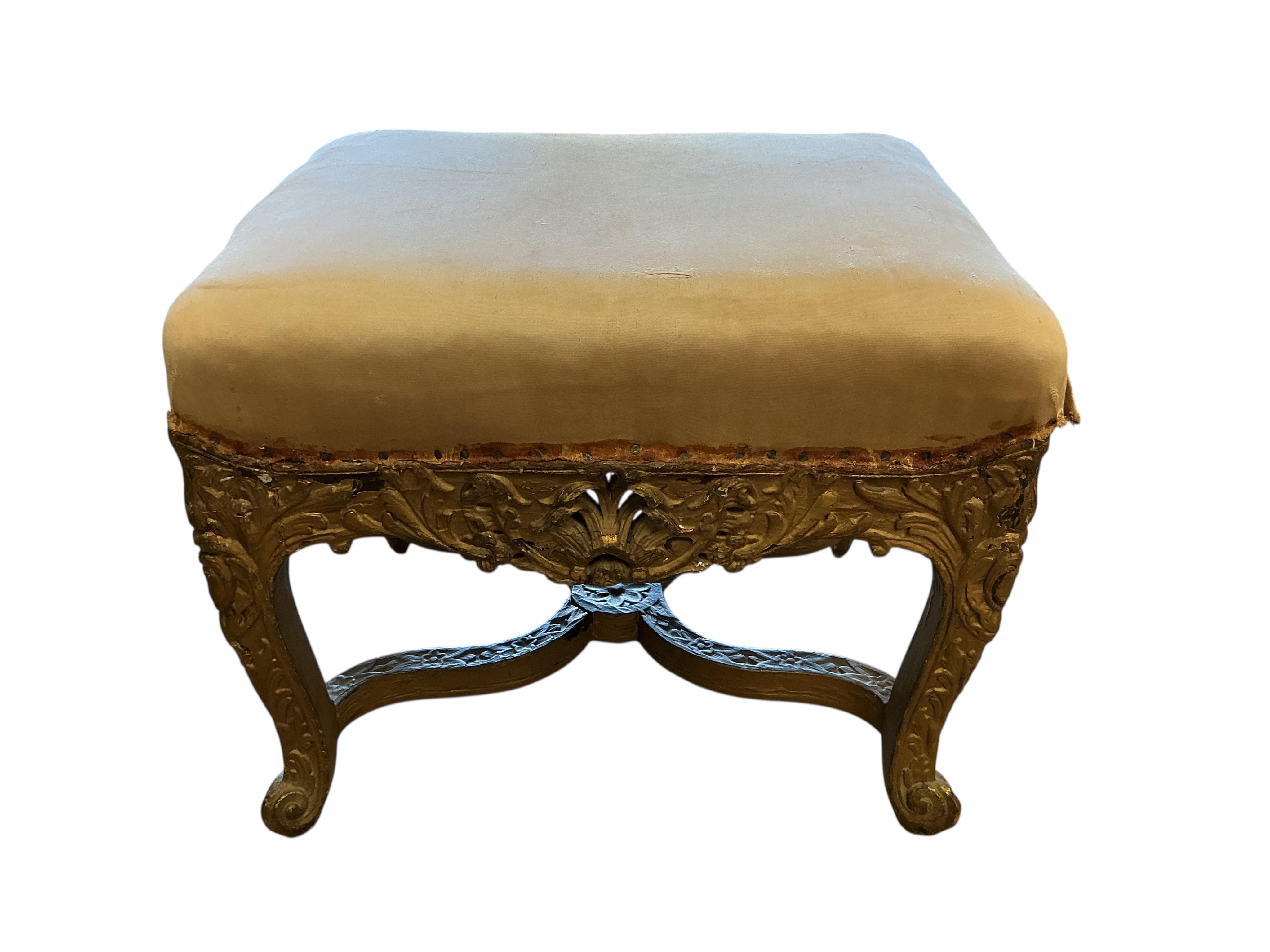 An 18th century carved giltwood stool, width 50cm, depth 40cm, height 40cm
